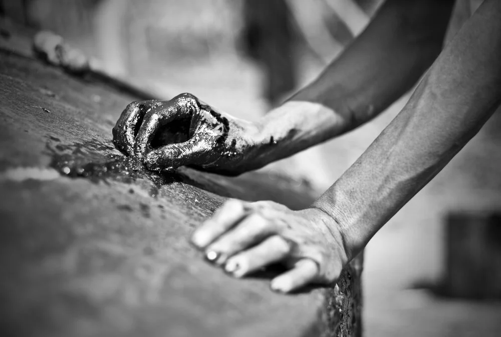 Fisherman repairing his boat - Fineart photography by Jakob Berr