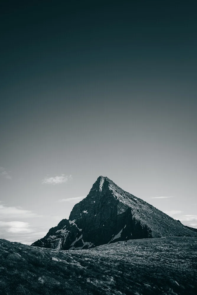 Black and white photo of a mountain in Norway, capturing the tranquility of nature.