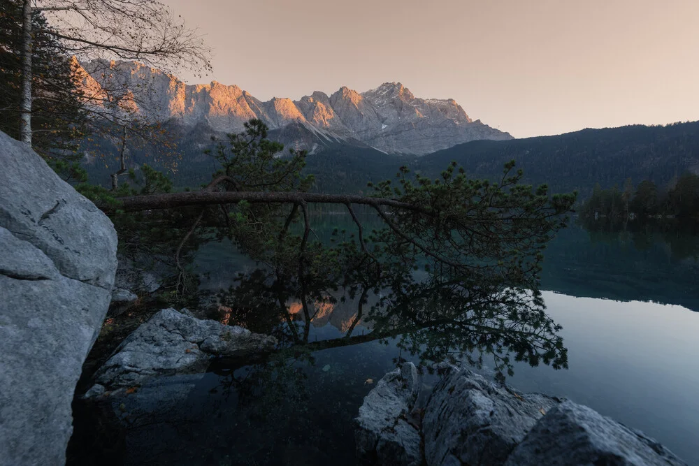 Photo art by Patrick Noack: gentle alpenglow at Lake Eibsee during sunset.