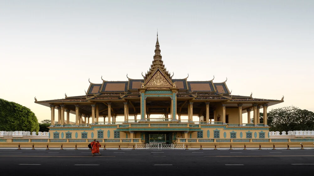 Photo art: calm capture of the Royal Palace in Cambodia with monk in the foreground.