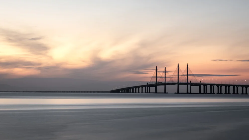Photo art by Christian Janik: sunrise over the Penang Bridge by the water