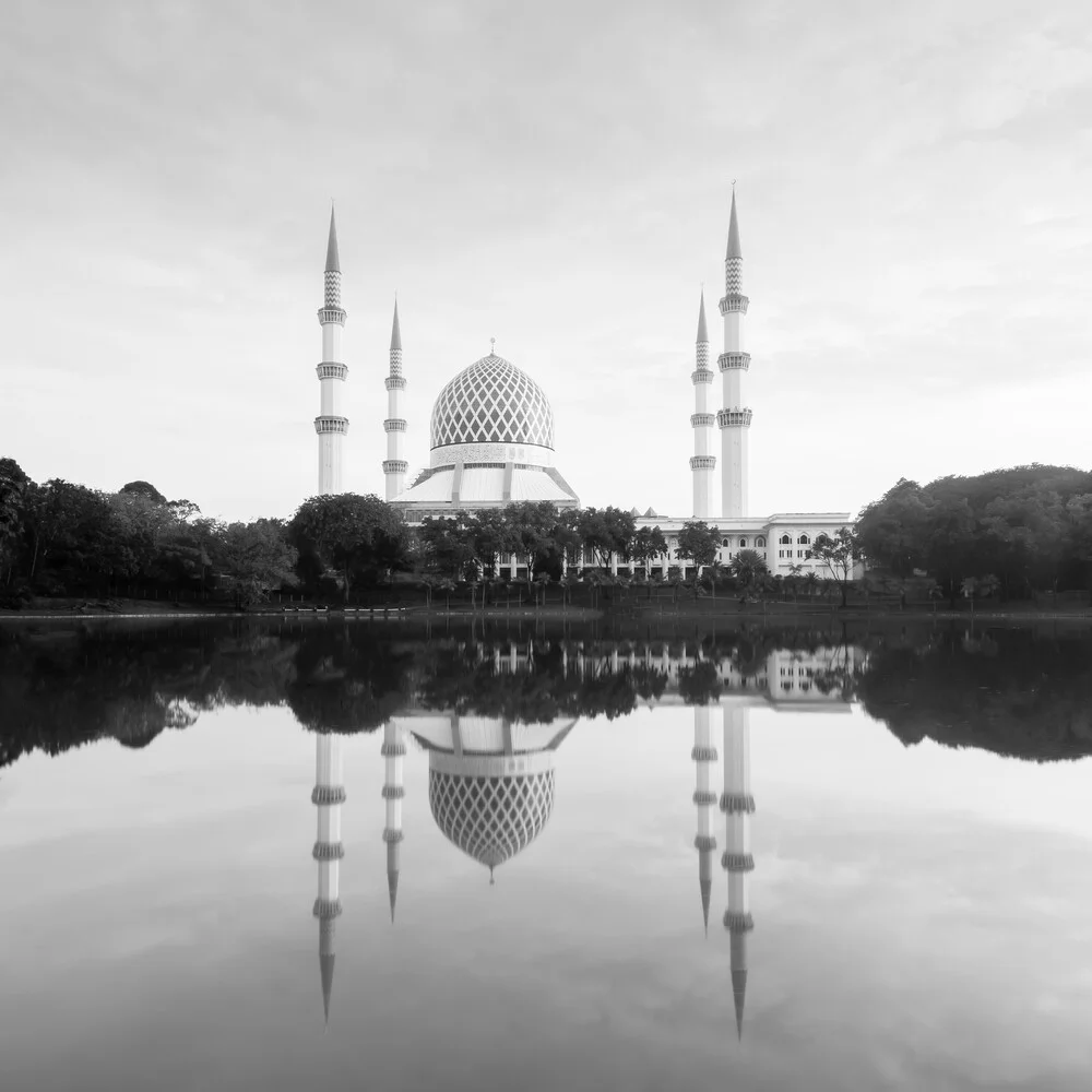 Photo of the Blue Mosque with soft light and reflection in the water.