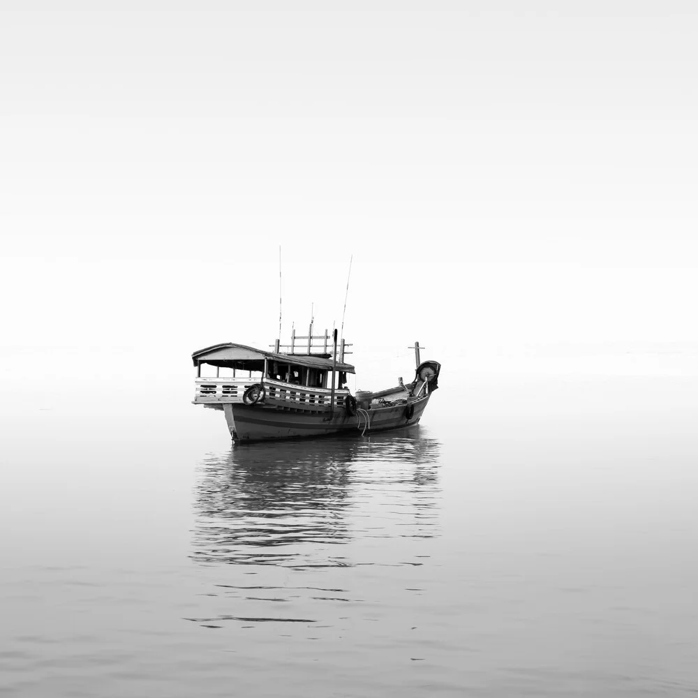 Photo art: A boat on the water at sunset in Cambodia.