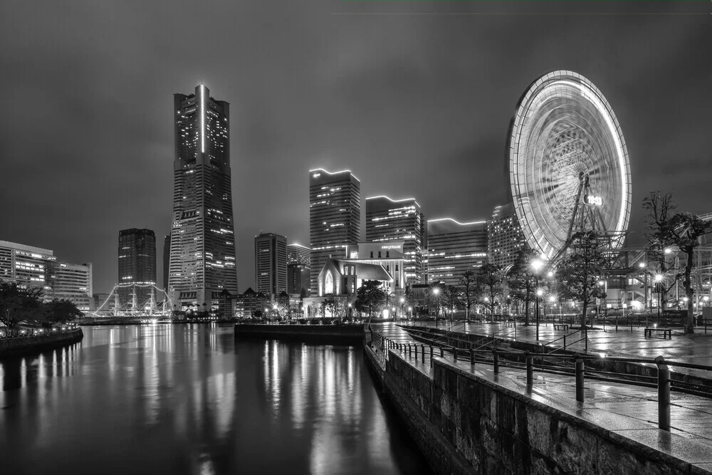 Night photo of Yokohama skyline featuring bright skyscrapers and harbor vibe