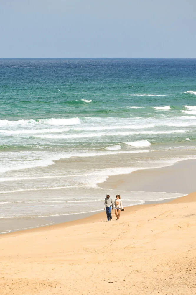 Photo art by Lotte Wildiers: gentle coastal landscape with blue sky and golden sand