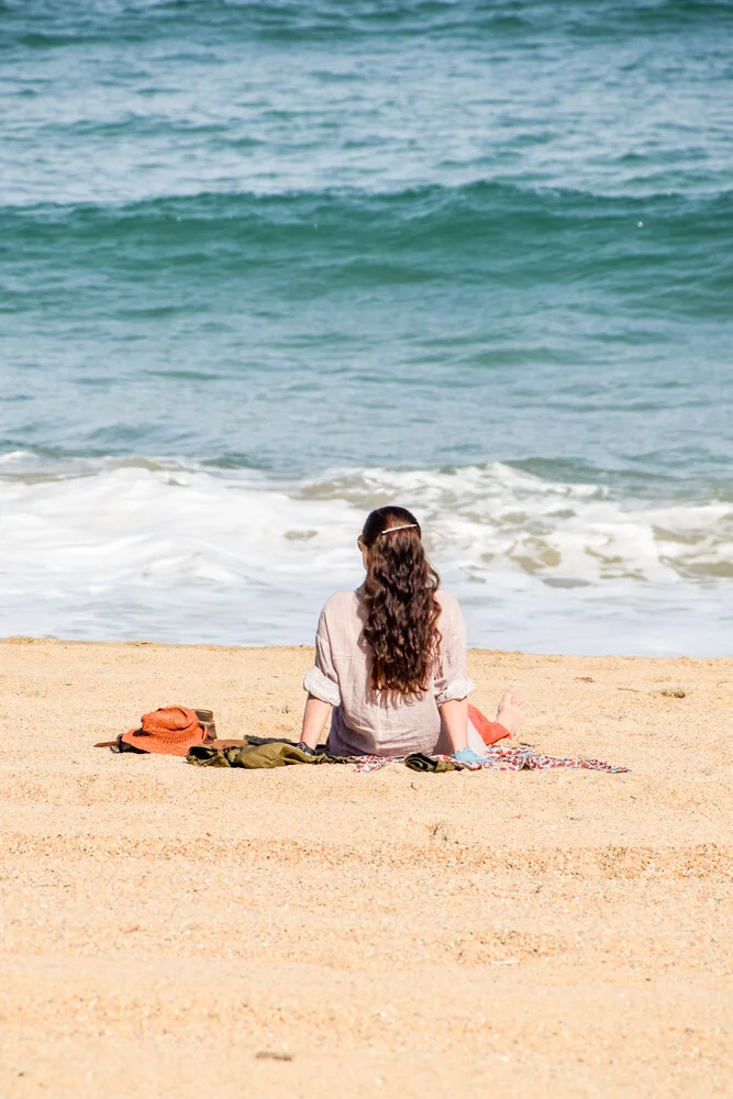 Photo art by Lotte Wildiers: Woman at golden beach in Biarritz with blue sea