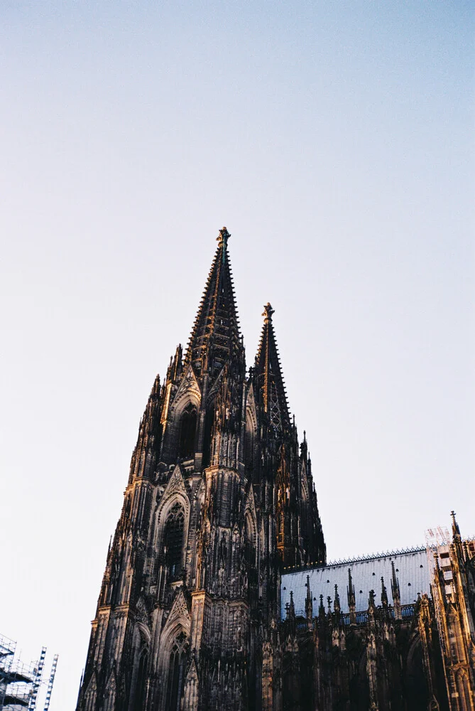 Photo art by Ben Hammer: view of Cologne Cathedral under a blue sky.
