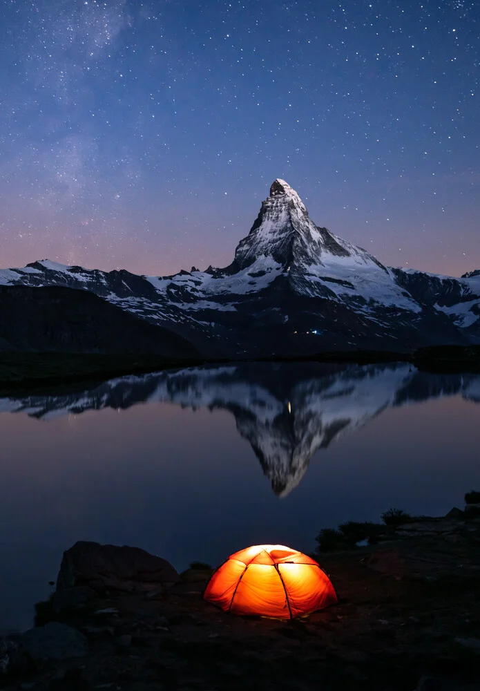 Starry sky above the Matterhorn with tent by Stellisee, calm atmosphere, photo art.