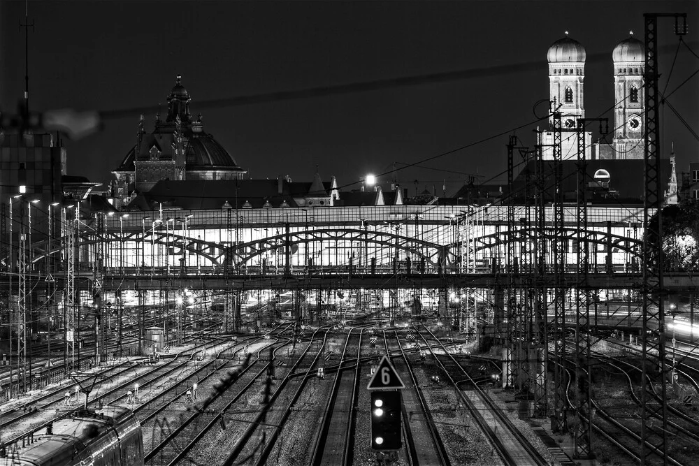 Photo art by Achim Thomae: Munich's night view featuring a lit railway station