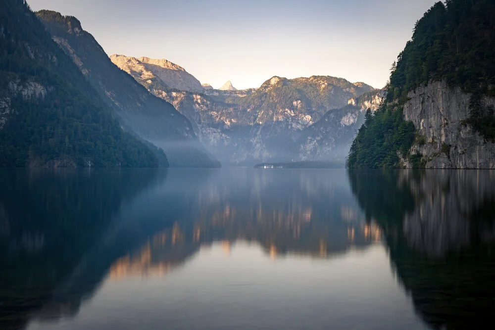 Morning scene at Lake Königssee with gentle misty clouds.