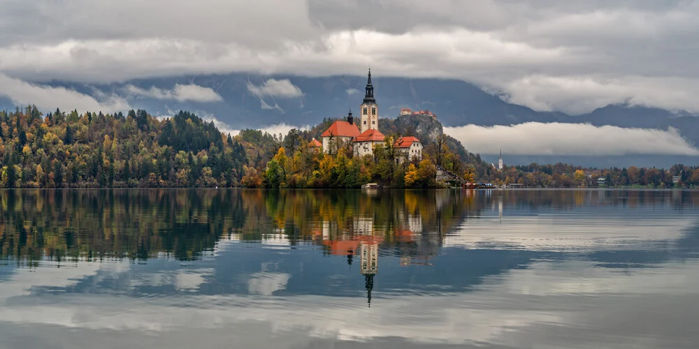 Lovely morning atmosphere at Lake Bled with church and castle in the background