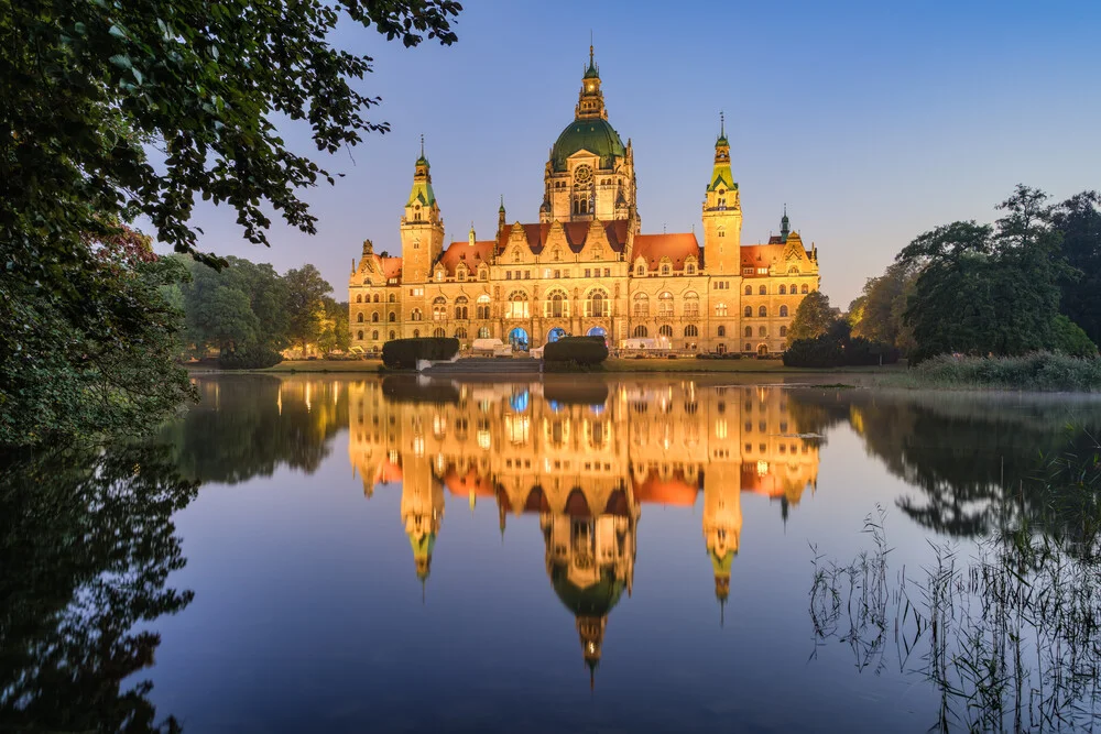 Early morning at the New Town Hall in Hanover with reflection in the pond.