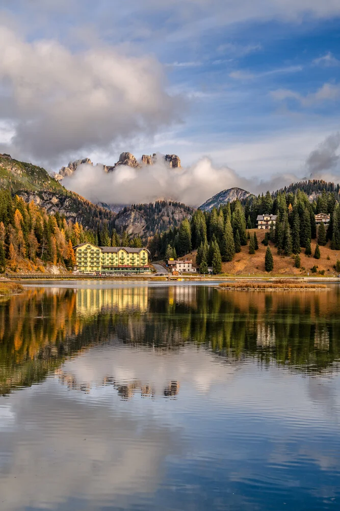 Beautiful autumn landscape at Misurina Lake in the Dolomites with reflections in the water
