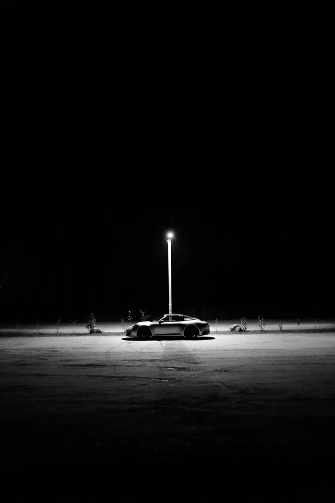 Black-and-white photo of a Porsche 911 Targa in soft light