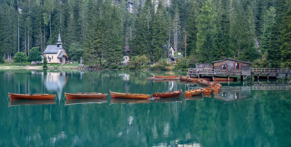 Photo art by Achim Thomae: tranquil landscape at Braies Lake with wooden boats