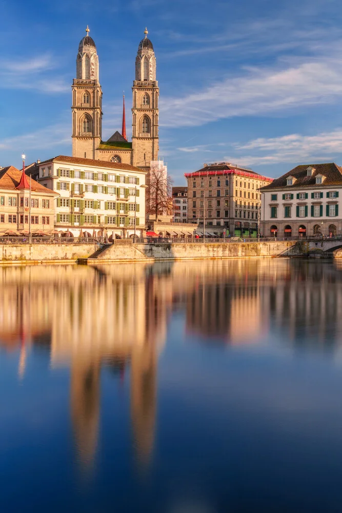 Photo art by Achim Thomae: Grossmünster church in Zurich with gentle reflection in the water