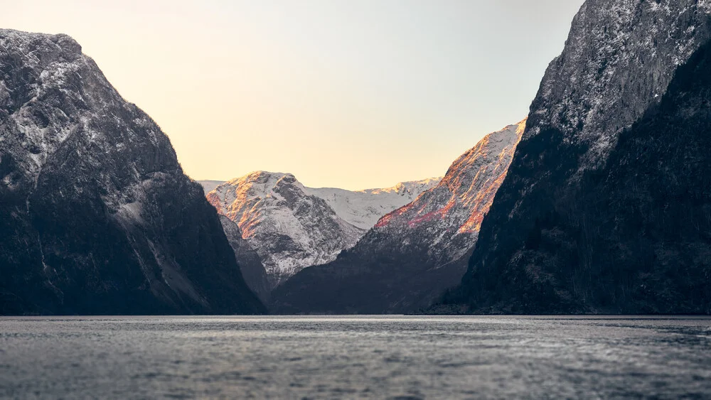 Photo art by Norbert Gräf: wintery Nærøyfjord with gentle mountains in evening light