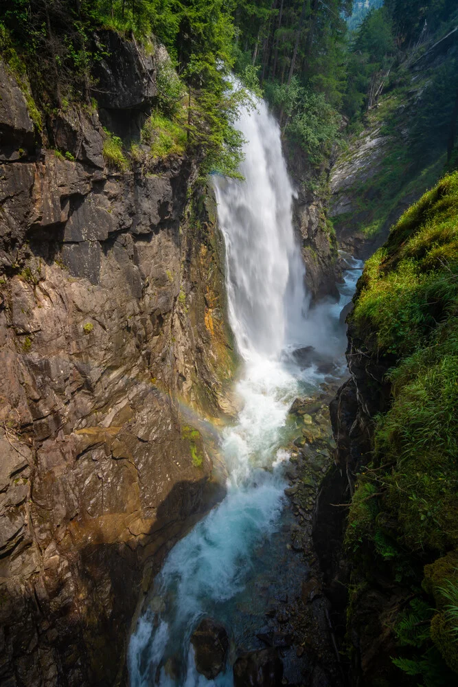 Photo art by Martin Wasilewski: waterfall in the Alps on a summer day.
