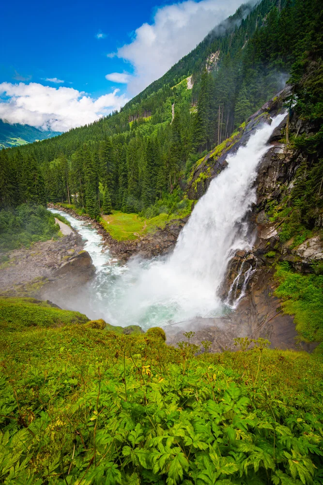 Photo art by Martin Wasilewski: Lower Krimml Waterfall in summer, surrounded by forest.