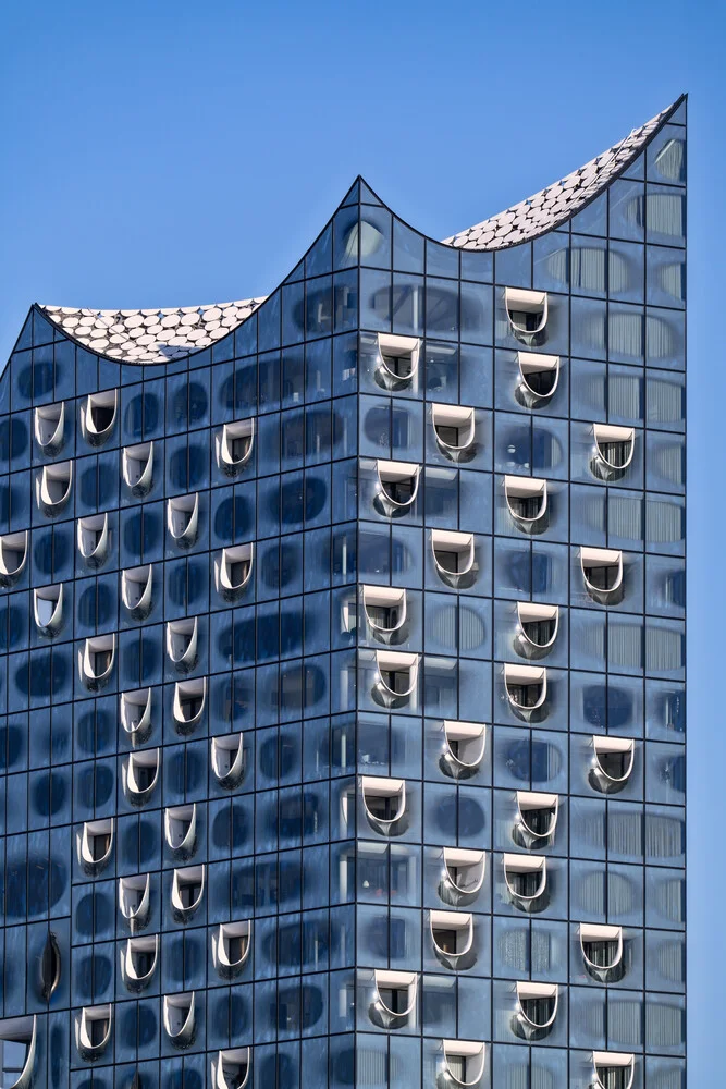 Close-up of the Elbphilharmonie in Hamburg featuring modern windows and clear architecture.