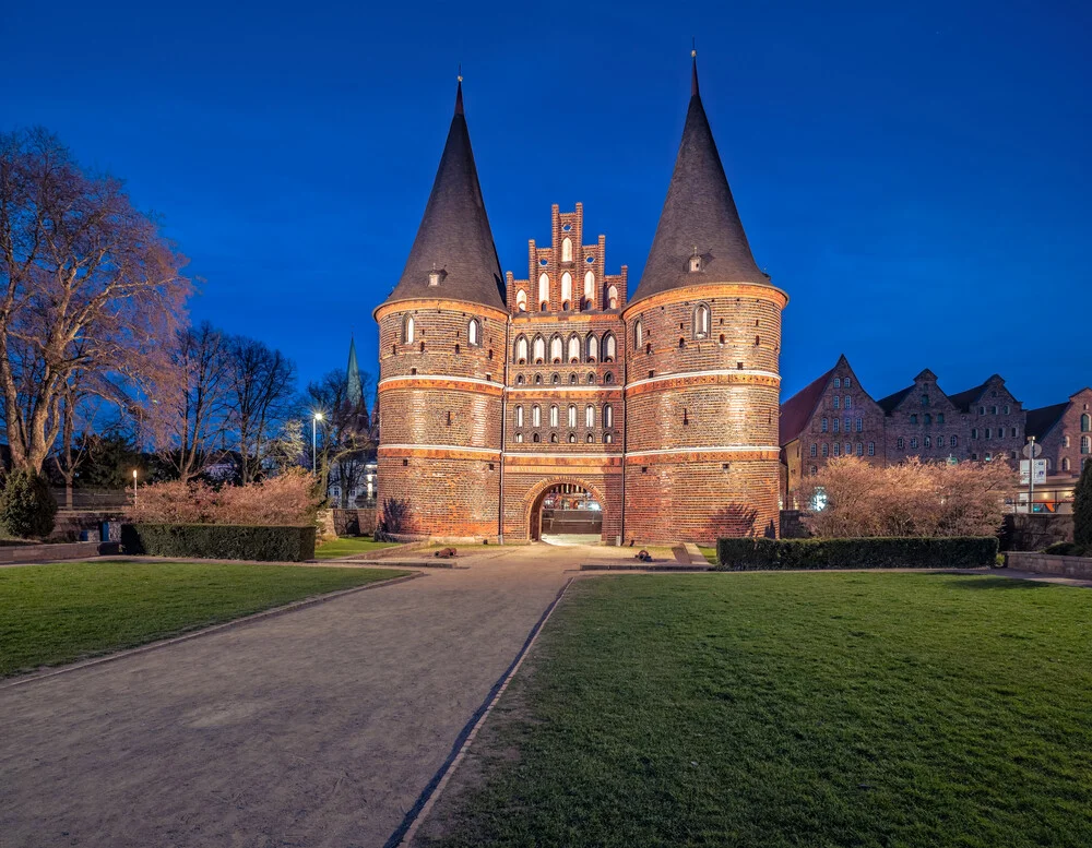 Photo art by Achim Thomae: Holstentor in Lübeck at blue hour.