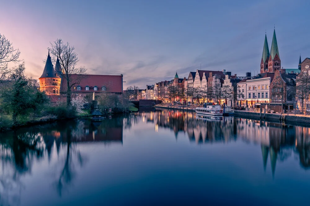 Photo art by Achim Thomae: city view of Lübeck at sunset featuring the Holstentor