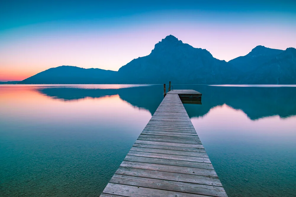 Dawn at Lake Traunsee with soft colors and calm waters