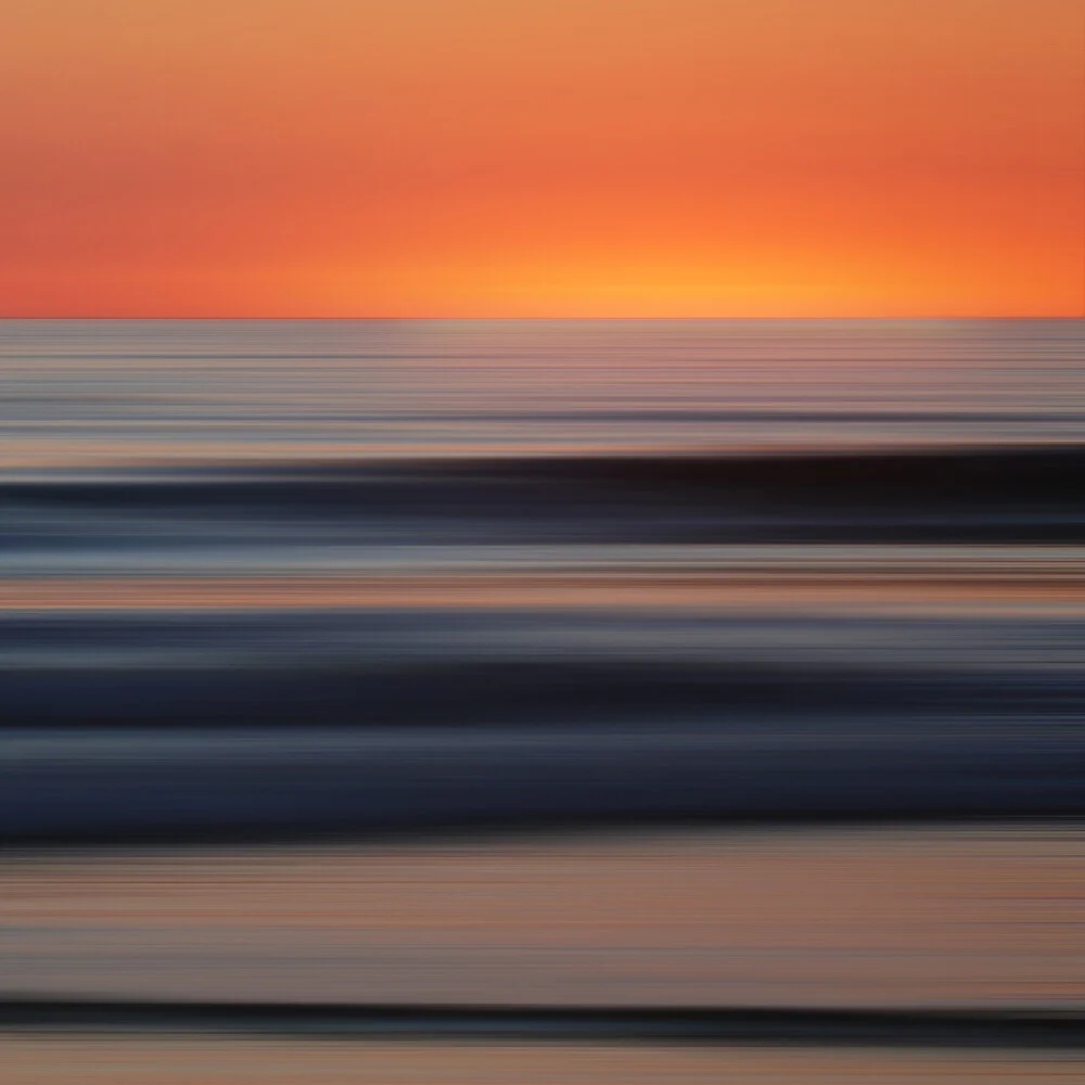 Photo art by Steffi Louis: gentle waves at the shore with a calm sunset.