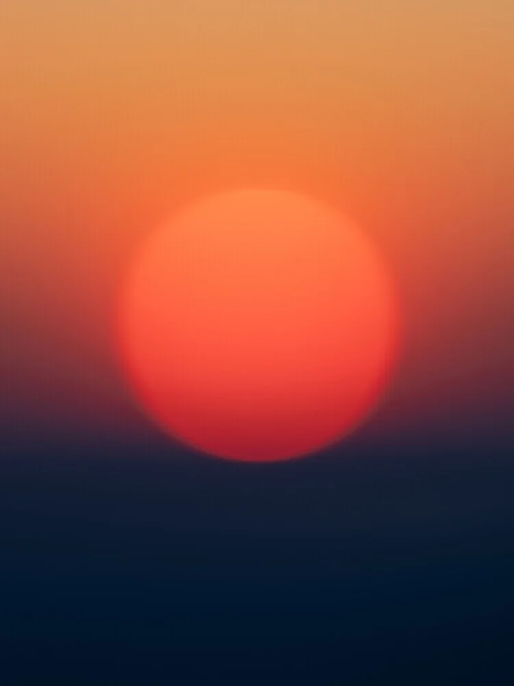 Calm photo art featuring soft colors of a sunset over the landscape.