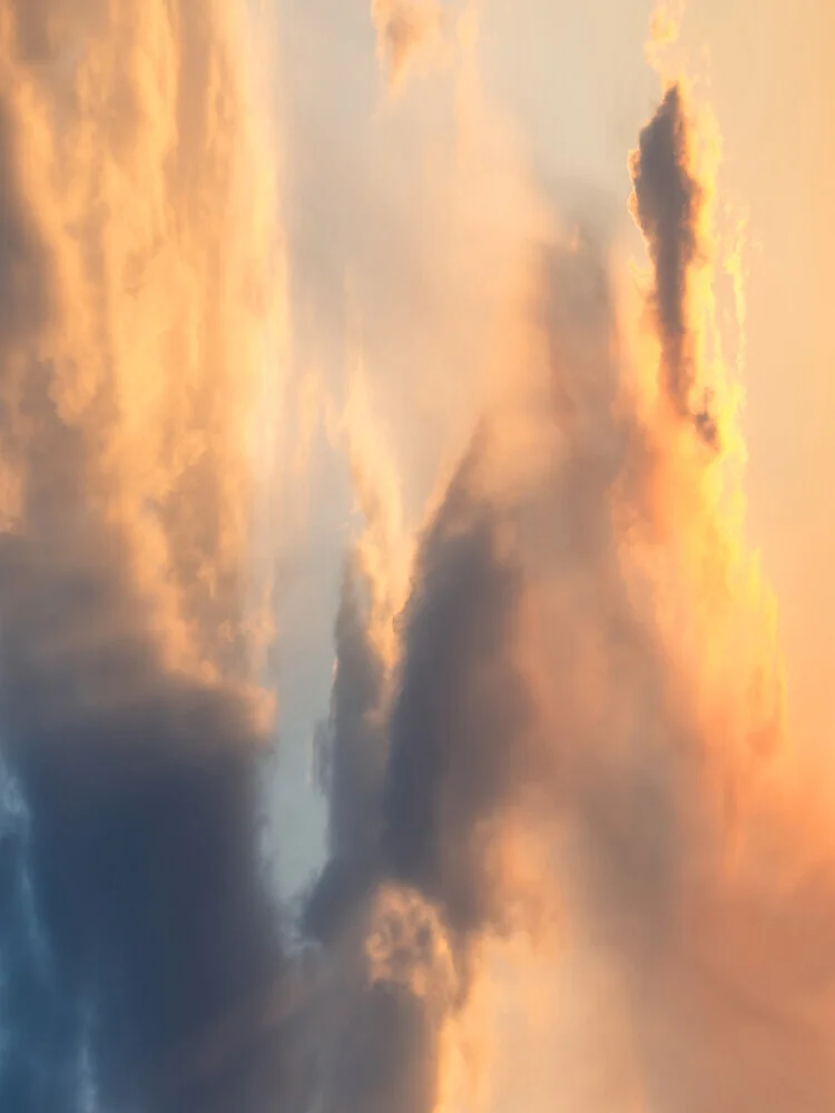 Photo art by Reiner Hofer: soft cloud formations in golden light