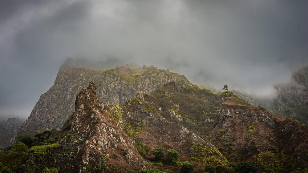 Photo art by J. Daniel Hunger: soft fog surrounds tall mountains