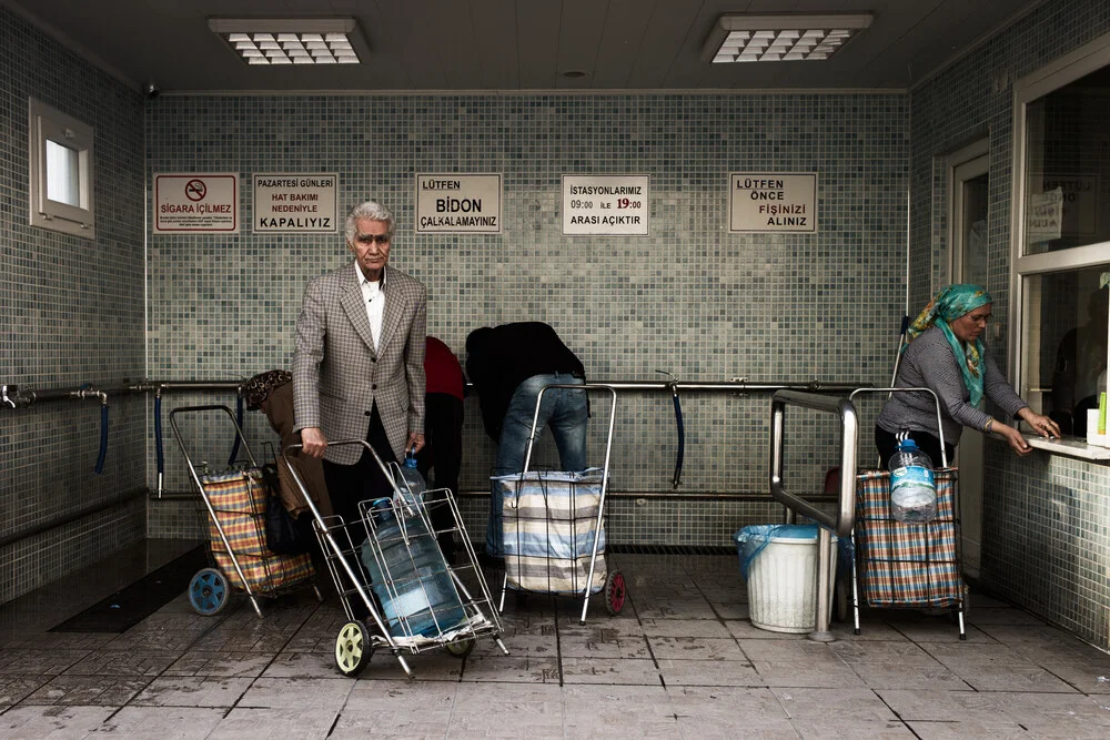 Collecting water from the council spring. - fotokunst von Carla Drago