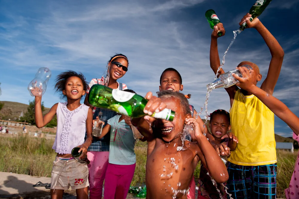 Kids with bottles - Fineart photography by Jac Kritzinger