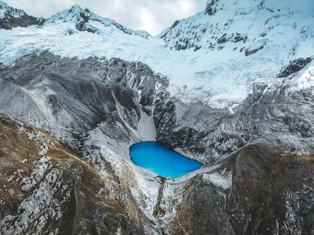 Blue lake between snowy mountains - Fineart photography by Tobias Winkelmann