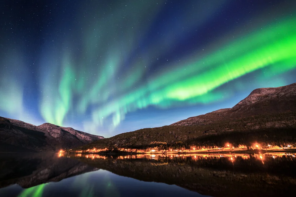 Northern lights at the fjord - light reflections of a village - Fineart photography by Felix Baab