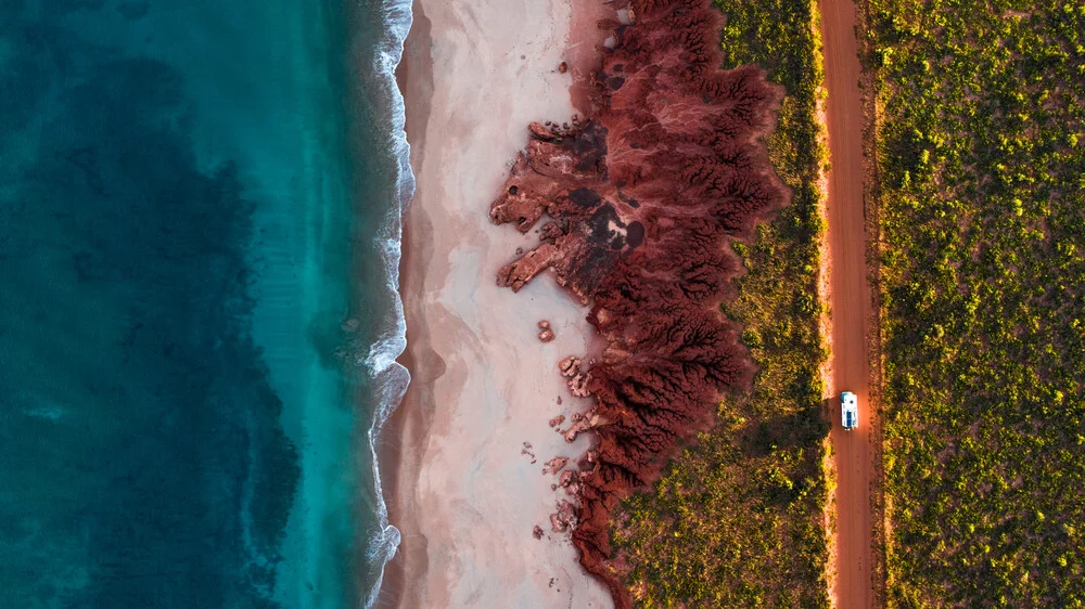 camping truck on rugged coastline from above - Fineart photography by Leander Nardin