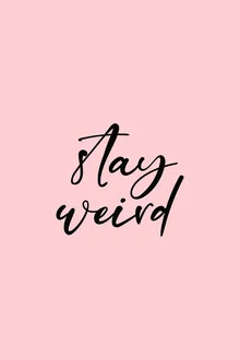 Wall art featuring an inspiring quote in playful typography on a pink background