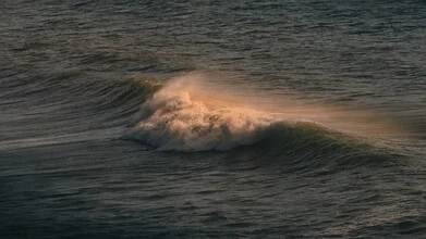 Photo art by Philipp Heigel: illuminated wave on the Atlantic at sunset