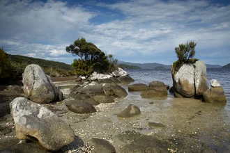 Photo art by Stefan Blawath: serene beach landscape with rocks and gentle waves