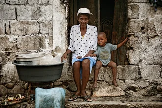 Photo art by Frank Domahs: mother with child in coffee production in Haiti