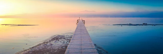 Gentle winter landscape at Lake Chiemsee with mist and soft colors