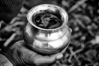 Photo art by Jagdev Singh: close-up of a Hindu holding the Ganges in his hand.
