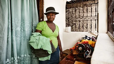 Photo art by Frank Domahs: portrait of a seamstress in Port-au-Prince, Haiti.