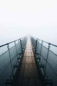 Photo art by Sergej Antoni: fog enveloping a suspension bridge in a mysterious atmosphere
