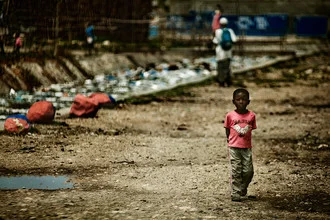 Photo art by Frank Domahs: Boy in a sewer in Port-au-Prince, Haiti.