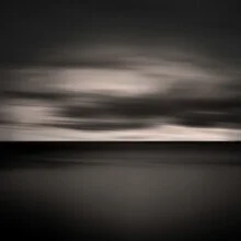 Photo of clouds over the sea, calm and minimalist in style.