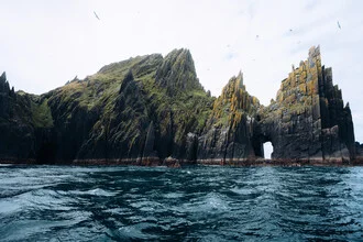 Scenic coastal landscape with cliffs and birds over the Atlantic Ocean