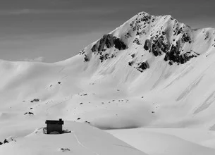 Photo art by Miriam Reugels: trail in the snow with a calm mountain landscape