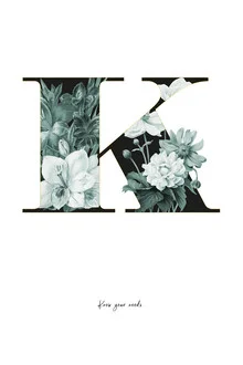 Wall art featuring a K made of flowers, radiating a soft boho style.