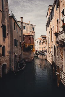 Moody Venice scene with a calm canal and autumn atmosphere